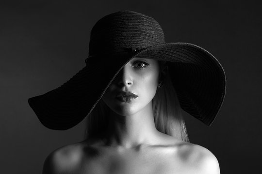 monochrome portrait of Beautiful woman in hat. fashion beauty girl