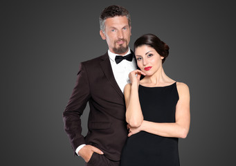 Happy mature couple on dark background