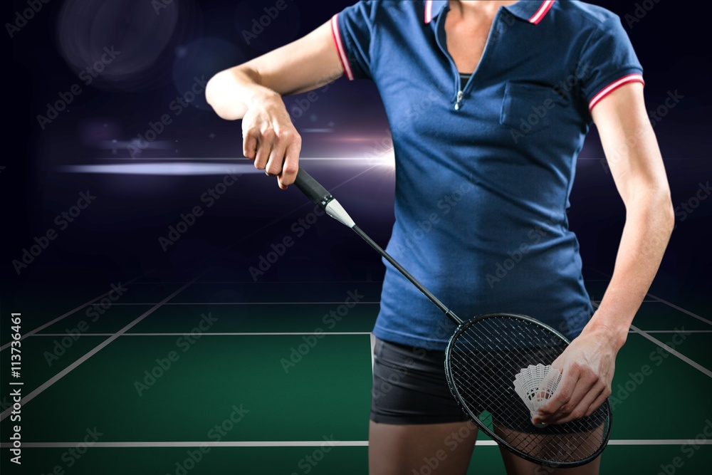 Poster badminton player holding a racket ready to serve