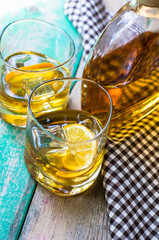 Glass of wiskey, lemon and ice