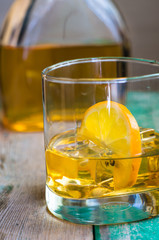 Glass of wiskey, lemon and ice