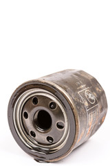 Black car oil filter over white background