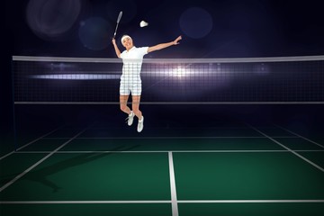 Composite image of badminton player playing 