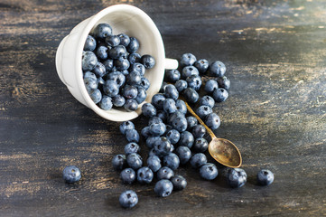 Bilberry on vintage wooden table