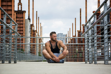 Handsome Muscular Hunk Man Outdoor in City Setting