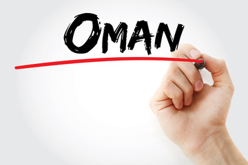 Hand writing Oman with marker, business concept background
