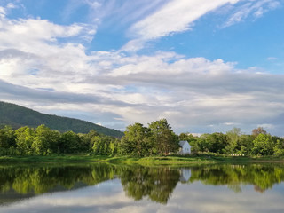 Fototapeta na wymiar Reflection of natural tree and sky in a lake