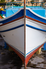 Fototapeta na wymiar Details of waterfront Fishing port in Marsaxlokk