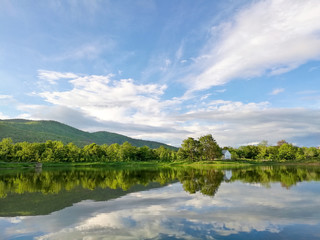 Reflection of natural tree and sky in a lake