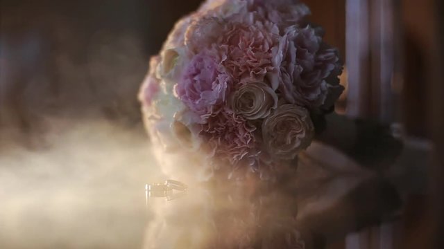 Wedding ring near a beautiful bouquet