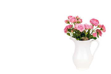Naklejka na ściany i meble Pink flowers in white jug.