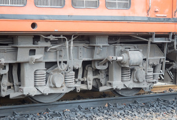 Obraz na płótnie Canvas Red orange train, Diesel locomotive, Industrial rail car wheels