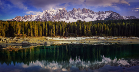 Dolomites Lake landscape with forrest mountain, Lago di Carezza,
