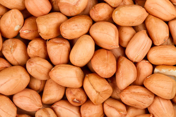 Obraz premium Top view of peeled peanuts healthy grains close up