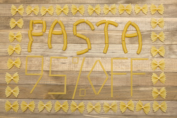 pasta  ninety five percent off text made of raw pasta