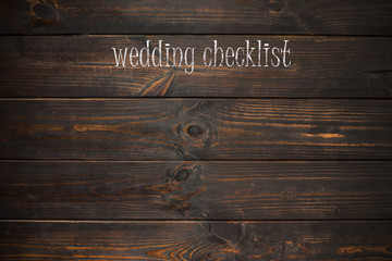 word wedding checklist  written on a wooden plate