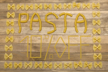 pasta  ten percent off text made of raw pasta