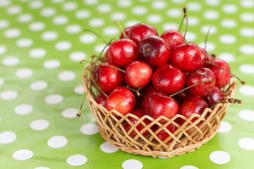 Pile of cherries in the wooden basket