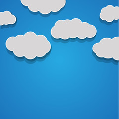Vector abstract background composed of white paper clouds over b