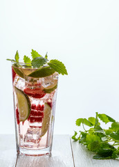 Homemade lemonade with strawberries, lime and mint