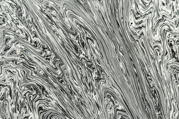 Swirls of pollen grains on water surface