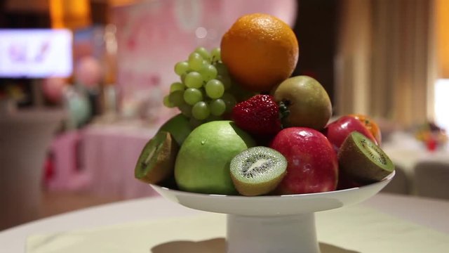 fruit in a vase on the table