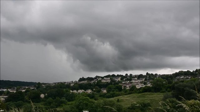 Summer storm clouds over Bath. Swirling dark thunderclouds over the city in Somerset, UK, bringing heavy rain.  32x normal speed