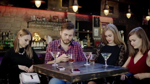 male Customer paying with a credit card in a pub
