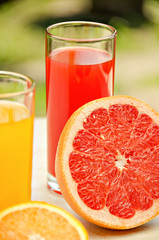 Fresh grapefruit and orange juice. Vitamins for health.