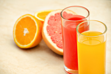 Fresh grapefruit and orange juice. Vitamins for health.