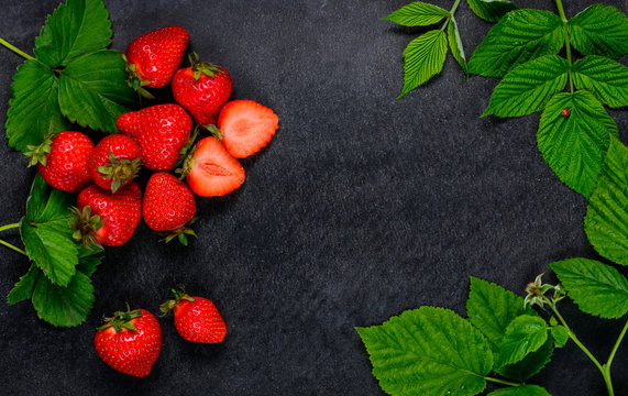 Red Strawberries and Green Leaves