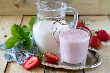 Fresh drink smoothies with strawberries on a rustic wooden backg