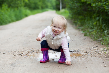 Happy smiling portrait of a 2 year old blonde girl