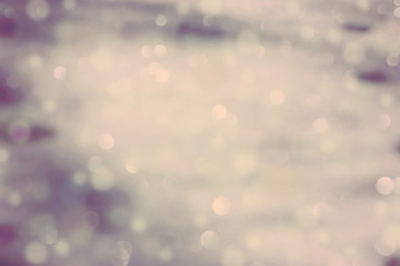 Real snow bokeh background texture, vintage look. Blurred lights. 