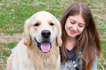 beautiful woman with a dog outdoors.