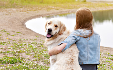 Girl and a golden retriever