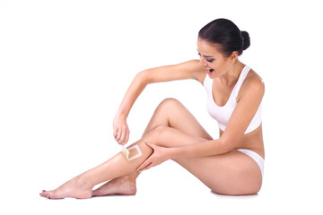 Obraz premium woman depilating her legs