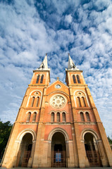 Fototapeta premium Saigon Notre-Dame Cathedral Basilica (Basilica of Our Lady of The Immaculate Conception) on blue sky background in Ho Chi Minh city, Vietnam. Ho Chi Minh is a popular tourist destination of Asia.