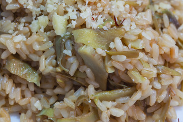Brown rice with carciofi and cheese.