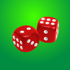 Red dice on green background