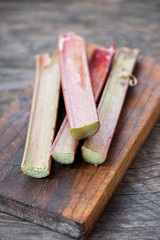 Fresh rhubarb on a wooden background