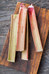 Fresh rhubarb on a wooden background