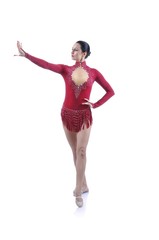 Beautiful artistic female gymnast working out, performing art gymnastics element