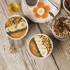 Healthy breakfast. Carrot Banana smoothie with granola and chia seeds