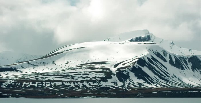 Timelapse of snowy mountains in cold arctic environment