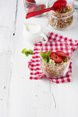 Healthy breakfast. Home crunchy granola with strawberries and cookies