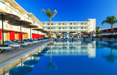 Fototapeta na wymiar modern hotel with swimming pool sunny Greece Rhodes