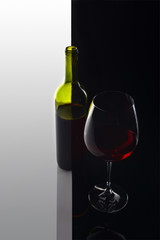  bottle and glass with red wine