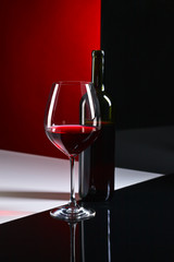  bottle and glass with red wine