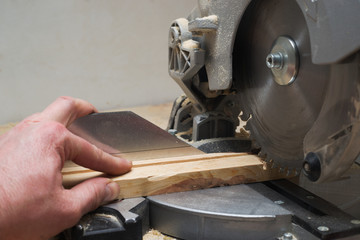 Carpenter tools on wooden table with sawdust. Circular Saw.
